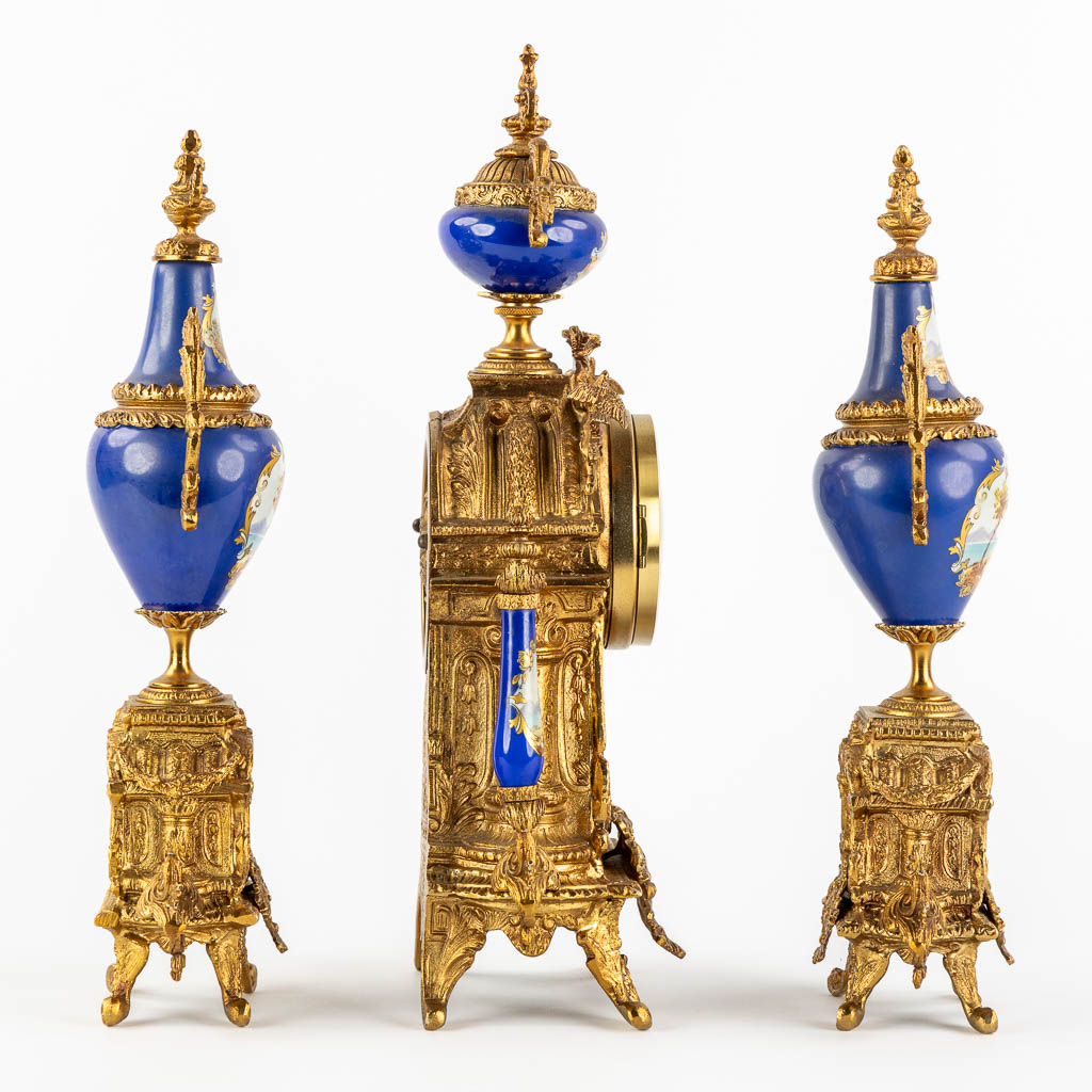 A three-piece mantle garniture clock and side pieces, bronze mounted with porcelain. (L:12 x W:20 x - Image 4 of 18