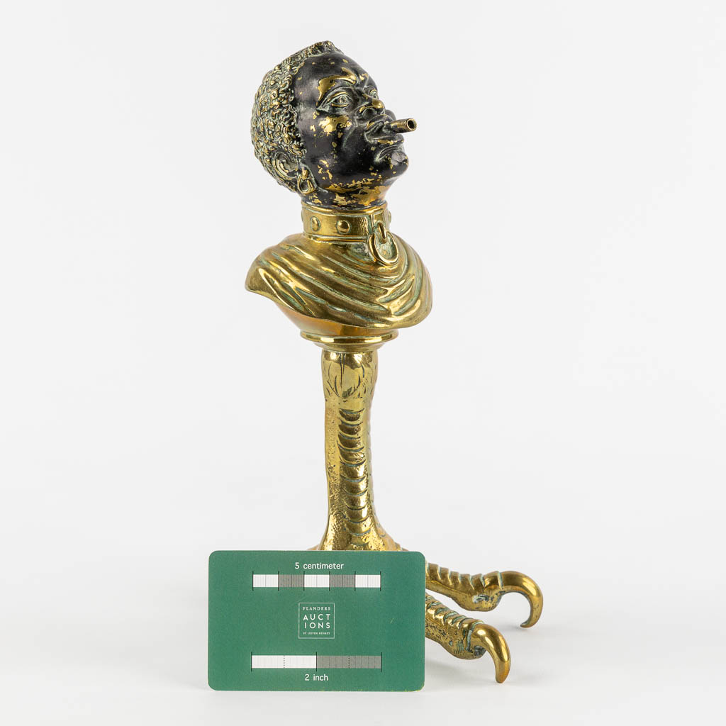 An antique Cigarette or Cigar lighter, polished bronze in the shape of a Blackamoor. 19th/20th C. (L - Image 2 of 11