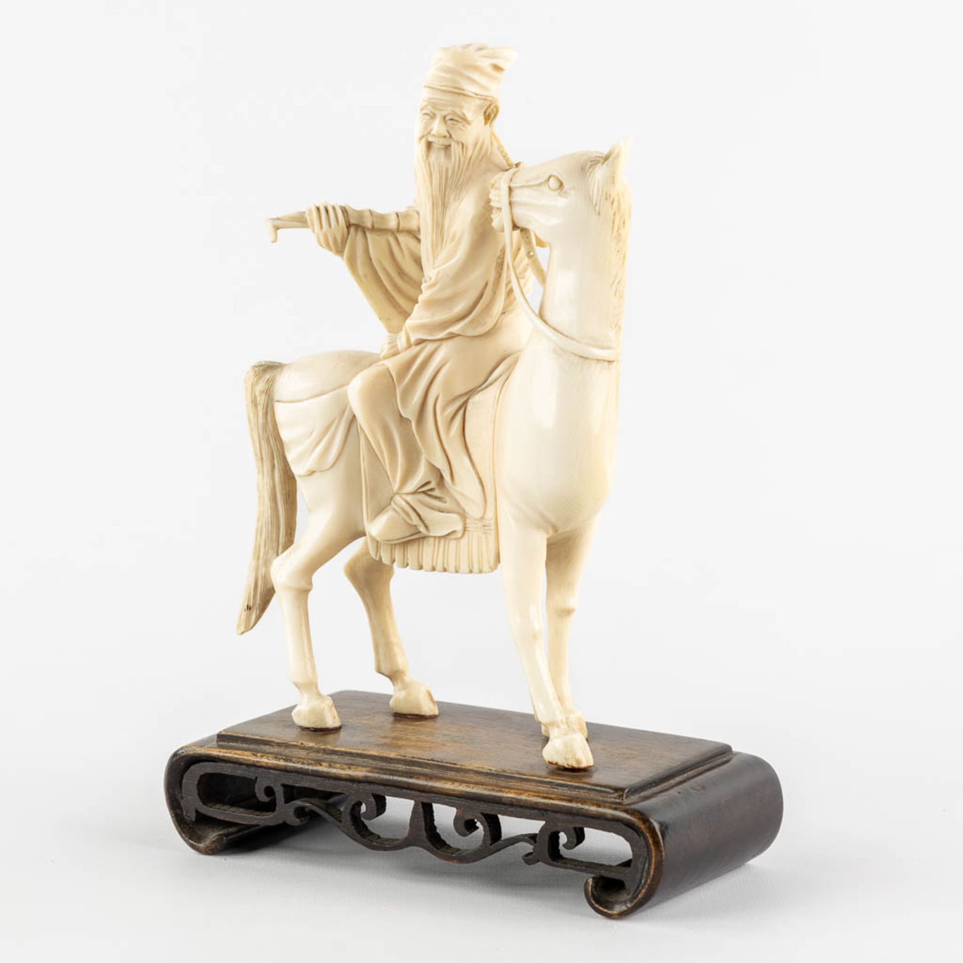 A Chinese sculptured figurine of Zhang Guolao, one of the eight immortals, ivory. (L:6 x W:12 x H:20 - Image 3 of 10