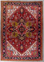 An Oriental hand-made carpet, Heriz. (L:350 x W:252 cm)