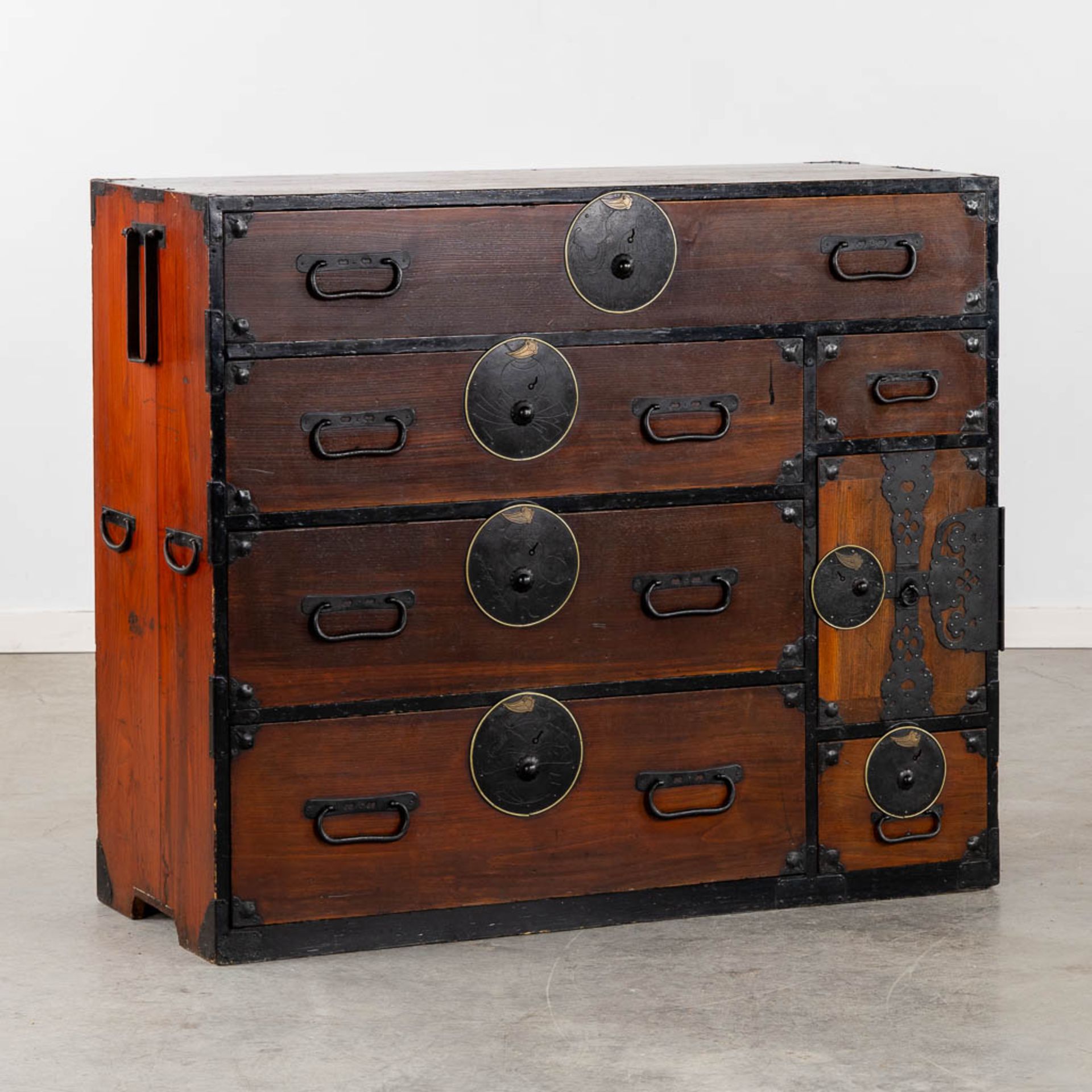 A Japanese 'Tansu' clothing cabinet, wood mounted with metal. (L:43 x W:111 x H:91 cm)