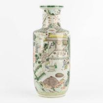 A Chinese Famille Verte 'Roulleau' vase with scènes of rice production. (H:46 x D:18 cm)