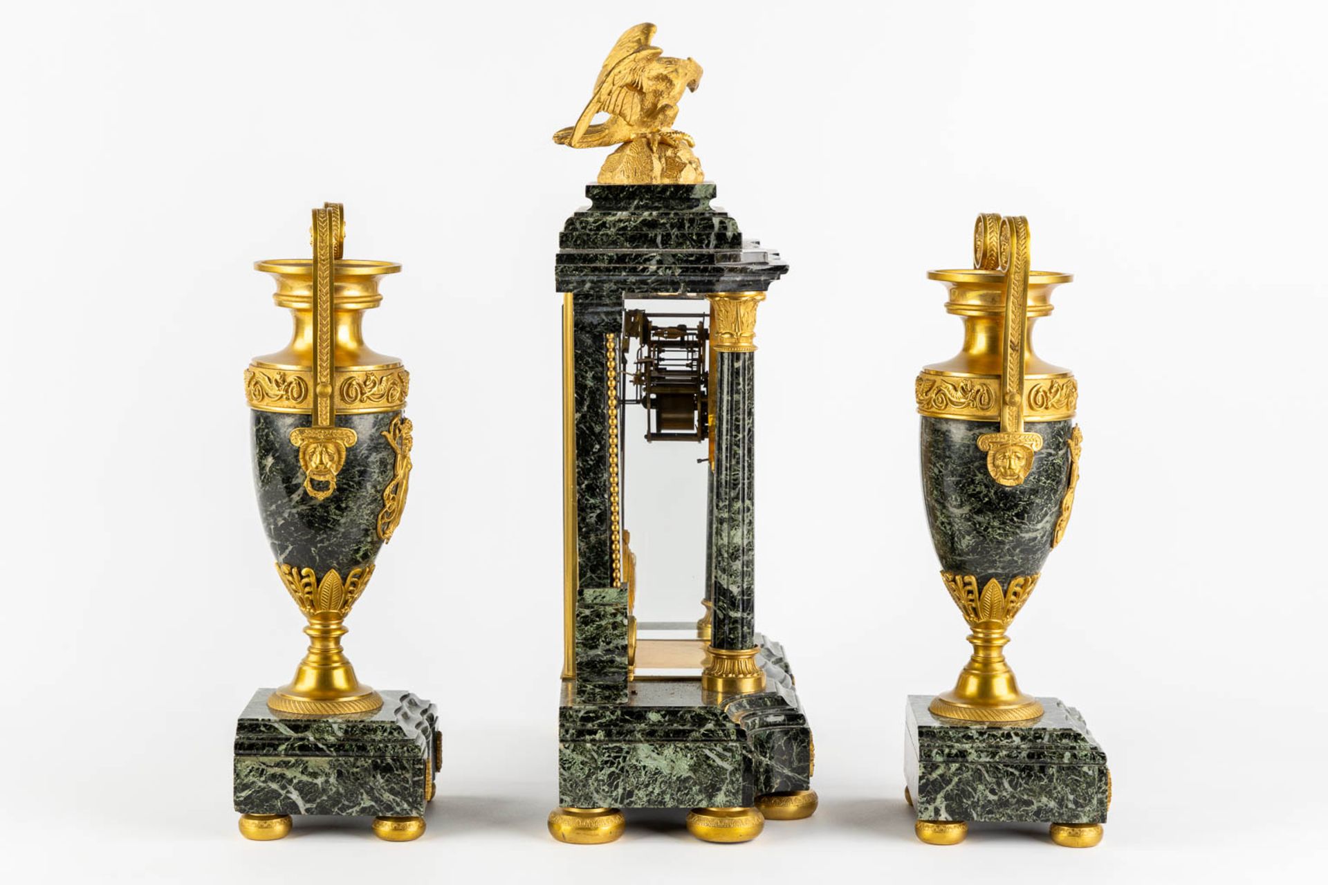 A three-piece mantle garniture clock and urns, gilt bronze on green marble, Empire style. France, 19 - Image 4 of 14