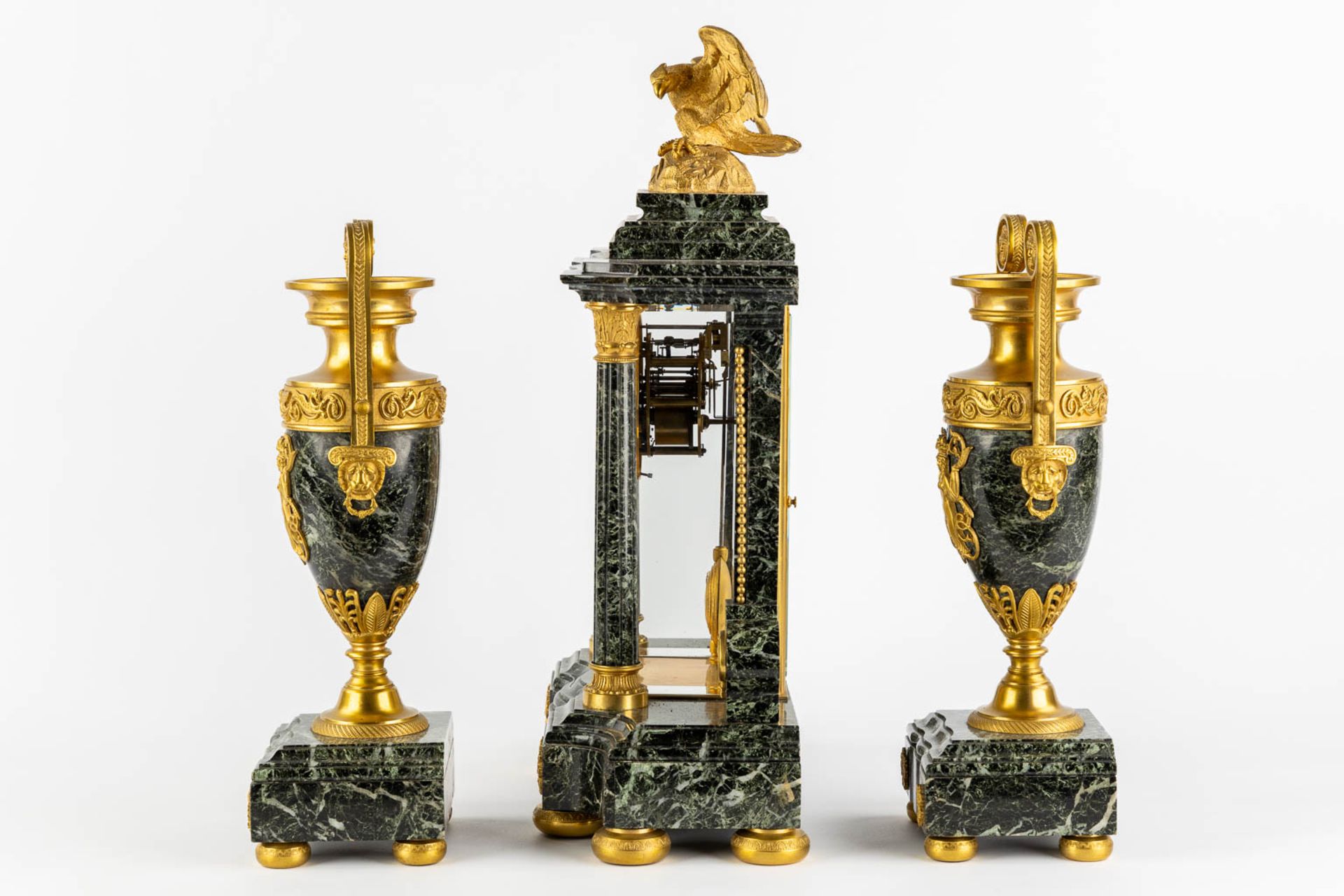A three-piece mantle garniture clock and urns, gilt bronze on green marble, Empire style. France, 19 - Image 8 of 14