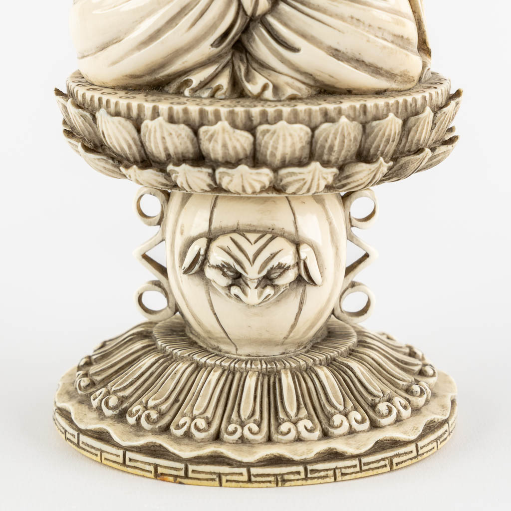 A Chinese Buddha holding a Pagoda, sculptured ivory. Circa 1900. (L:10 x W:12 x H:31 cm) - Image 10 of 11