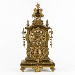 A mantle clock, bronze decorated with angels. Circa 1900. (L:21 x W:27 x H:54 cm)