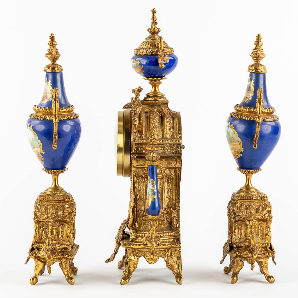 A three-piece mantle garniture clock and side pieces, bronze mounted with porcelain. (L:12 x W:20 x - Image 6 of 18