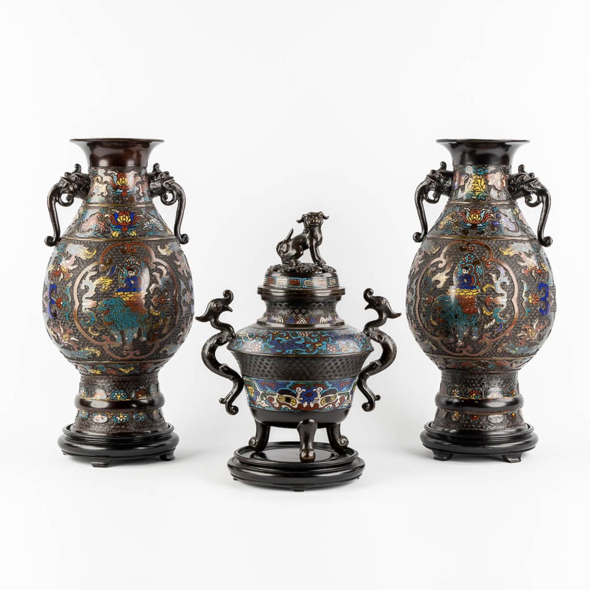 A pair of vases, added an insence burner, bronze with champslevé decor. Circa 1900. (H:45 x D:23 cm)