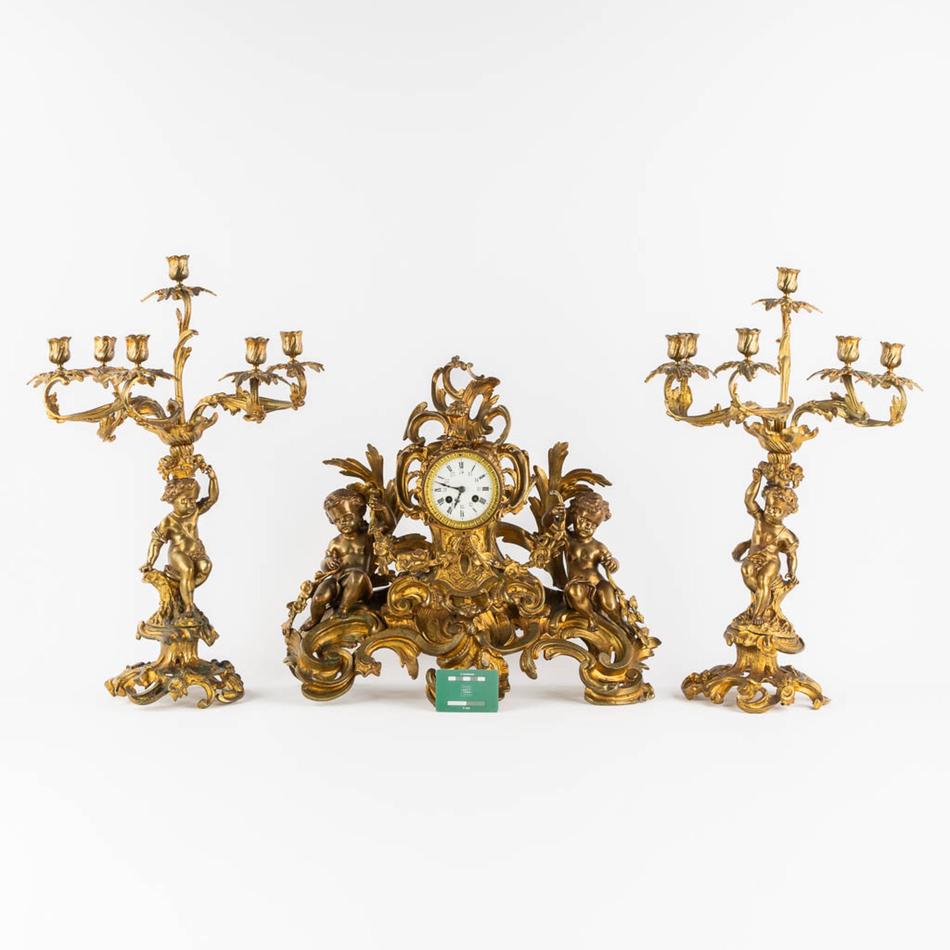 A three-piece mantle garniture clock and candelabra, gilt bronze. 19th C. (L:21 x W:55 x H:48 cm) - Image 2 of 16