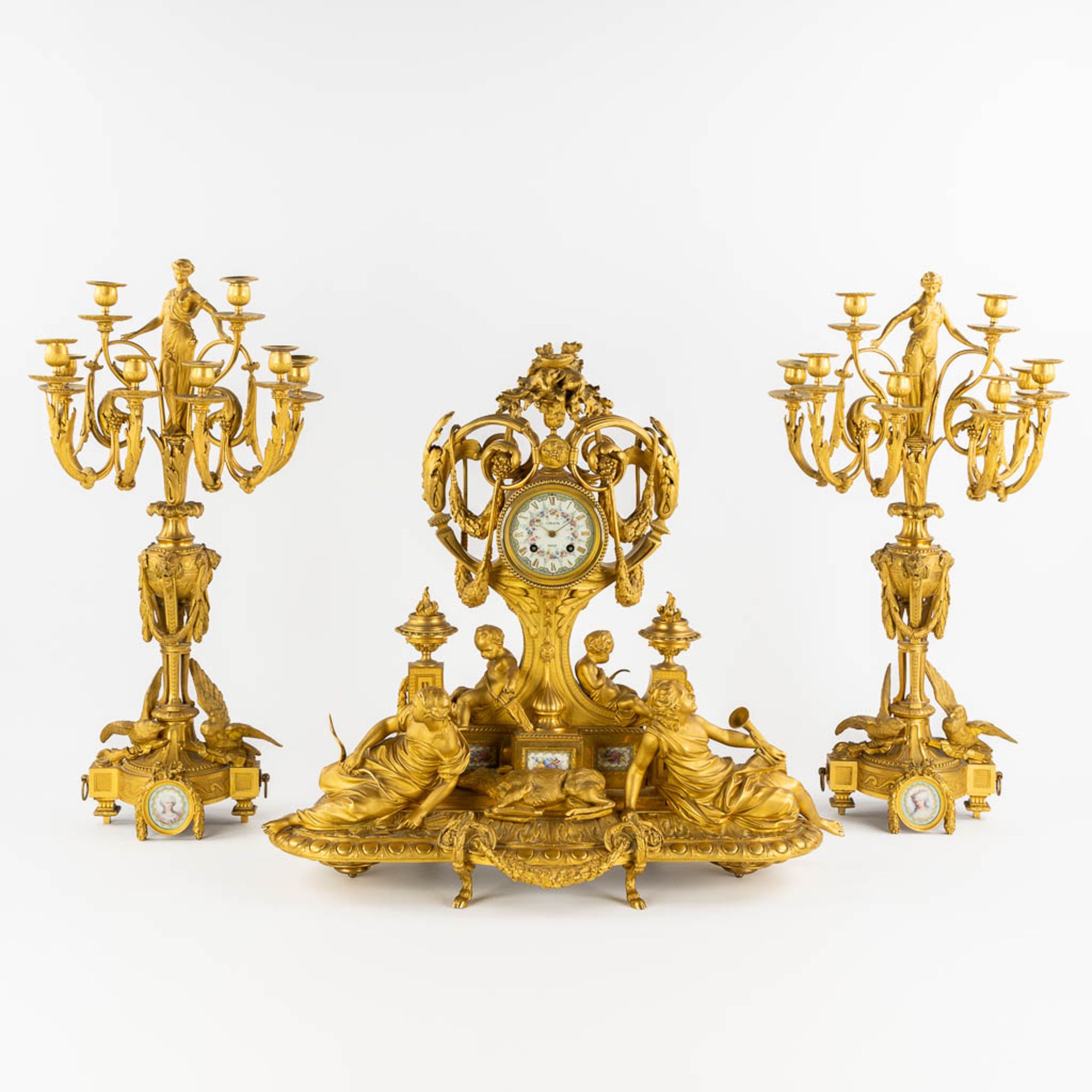 Lerolle Paris, a three-piece mantle garniture clock and candelabra, gilt bronze. France, 19th C. (L: