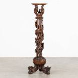 A Oriental hardwood pedestal with a sculptured dragon. (W:42 x H:125 cm)