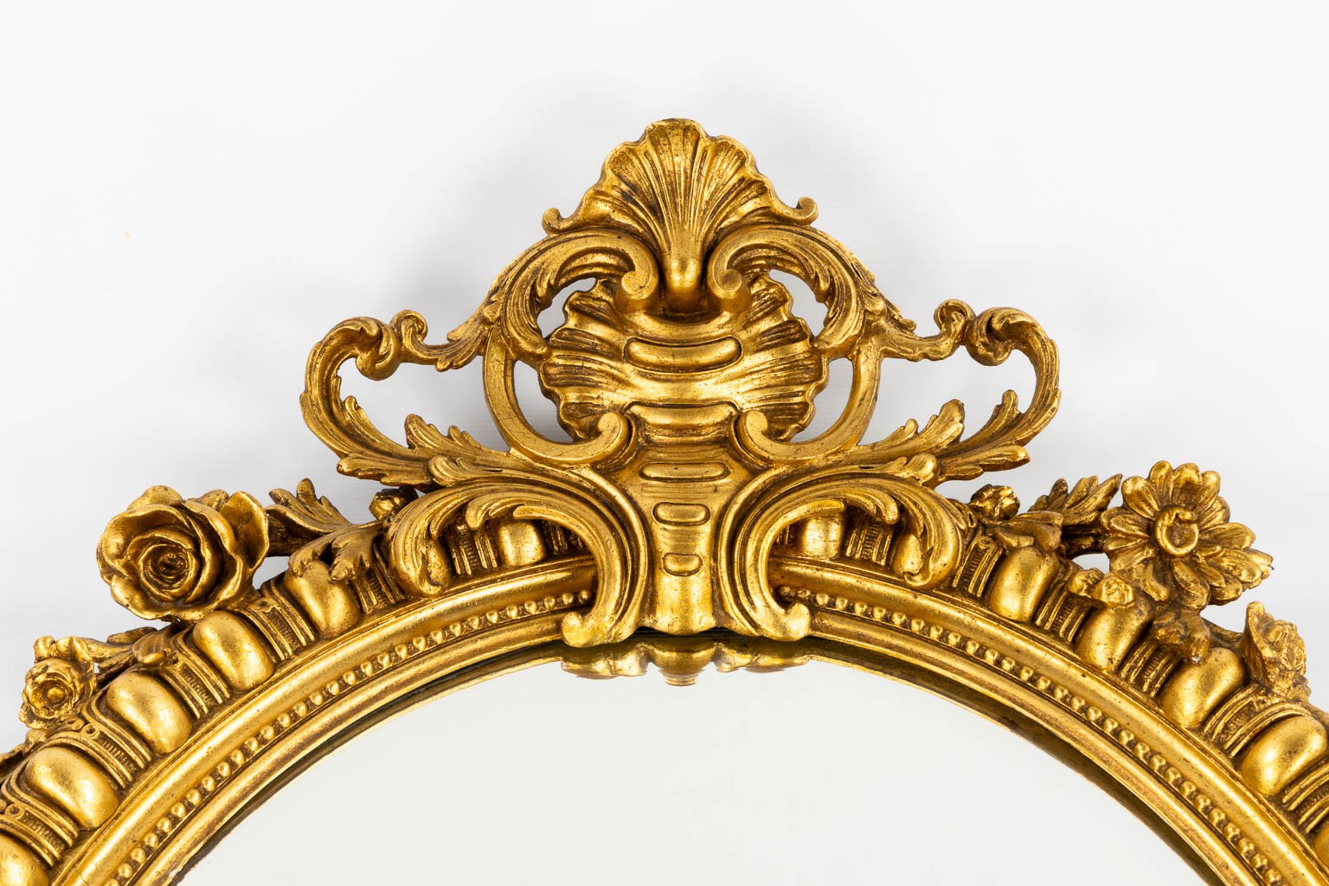 An antique mirror, gilt in a Louis XV style. 19th C. (W:89 x H:126 cm) - Image 3 of 8
