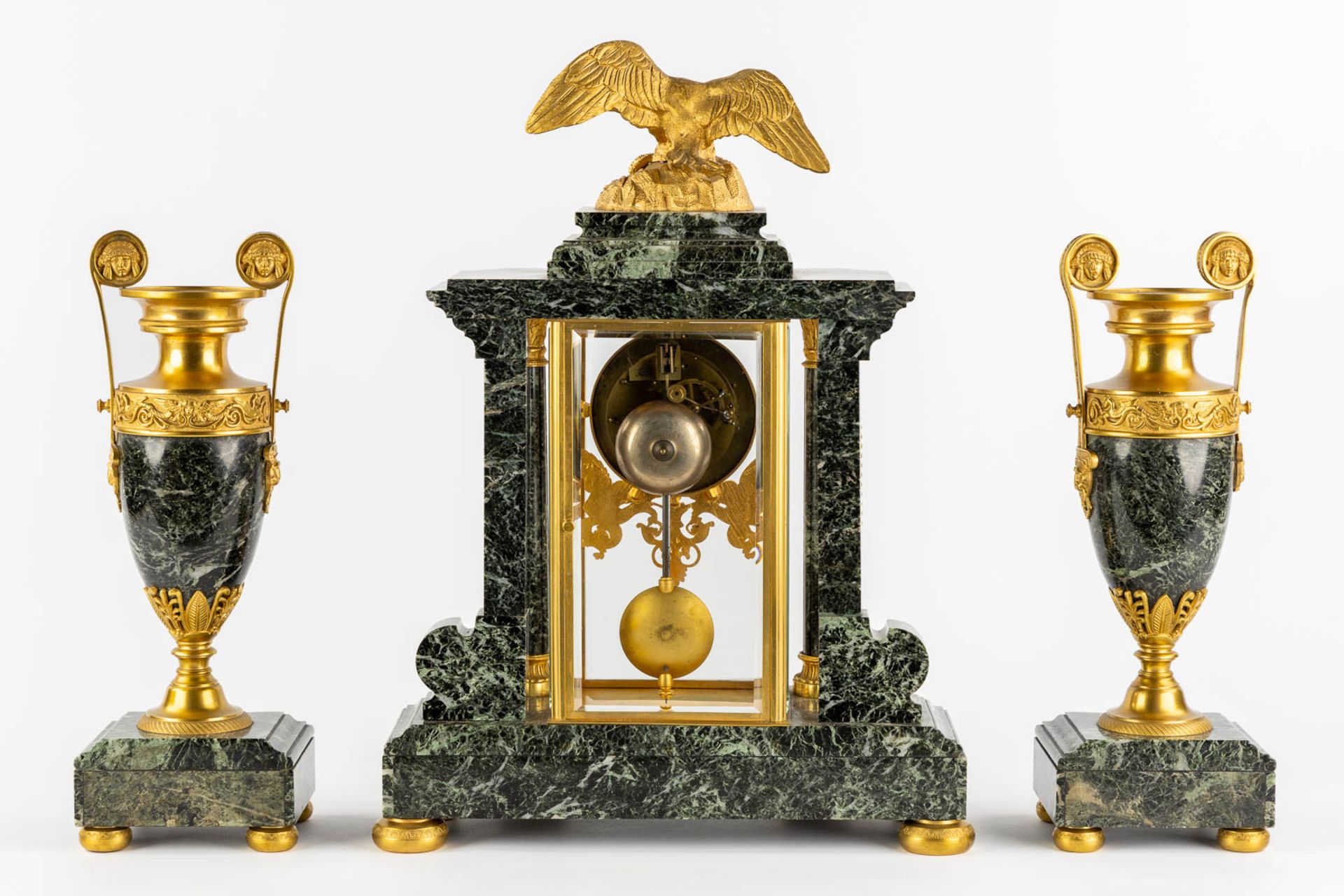 A three-piece mantle garniture clock and urns, gilt bronze on green marble, Empire style. France, 19 - Image 5 of 14