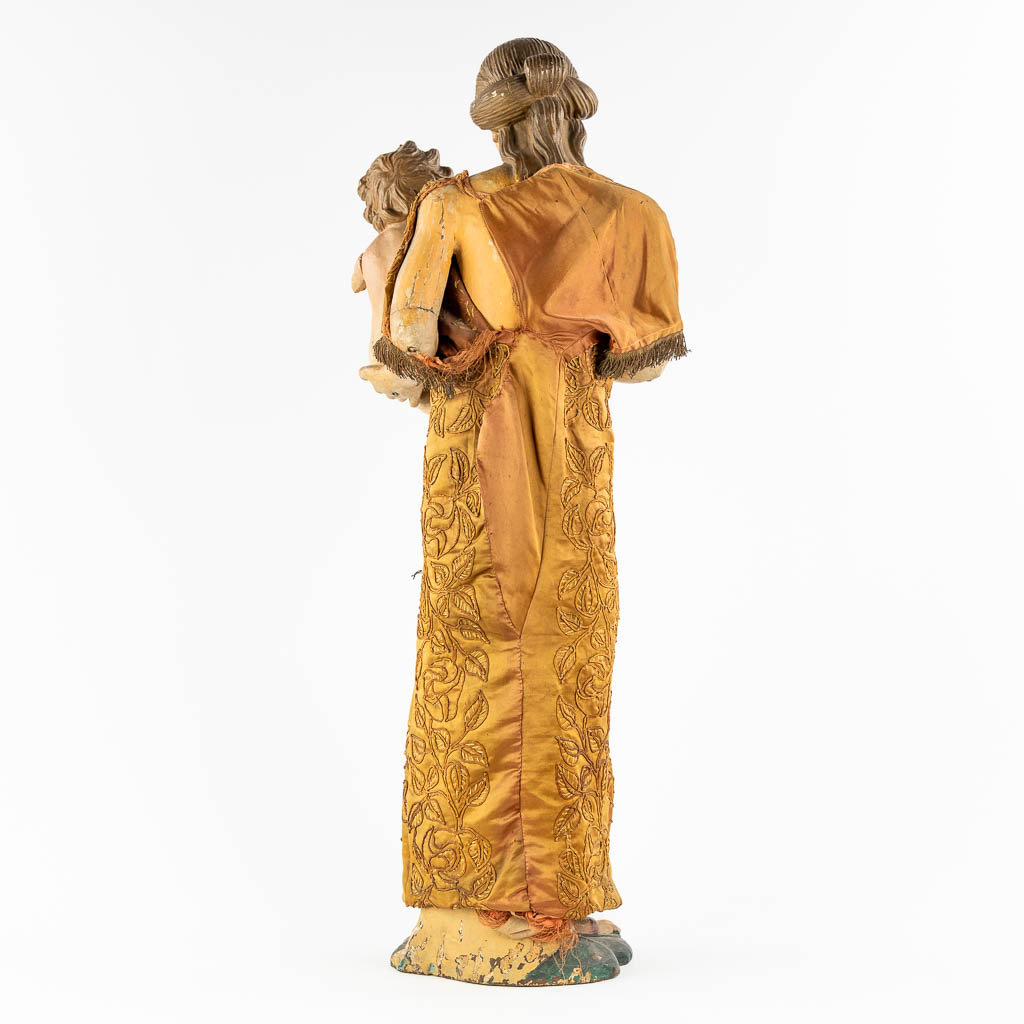 An antique sculptured figurine of a mother with child, wearing an embroidered robe. 19th C. (W:36 x - Image 5 of 15