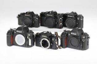 Six Black Nikon 35mm SLR Bodies