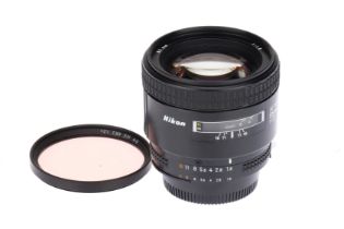 A Nikon AF Nikkor f/1.8 85mm Lens,