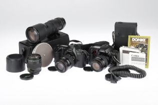 A Canon EOS-1 and an EOS 10s SLR Cameras