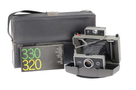 A Polaroid 330 Land Camera,