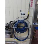 WALL MOUNTED HOSE REEL HOLDER AND HOSE.