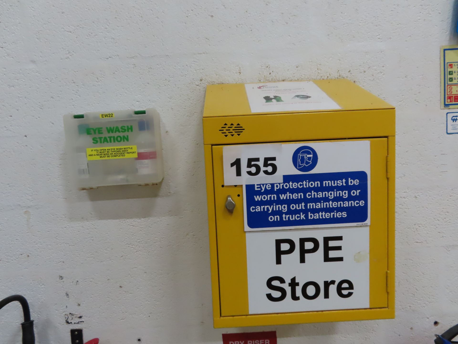 WALL MOUNTED PPE STORAGE UNIT AND EYE WASH STATION.