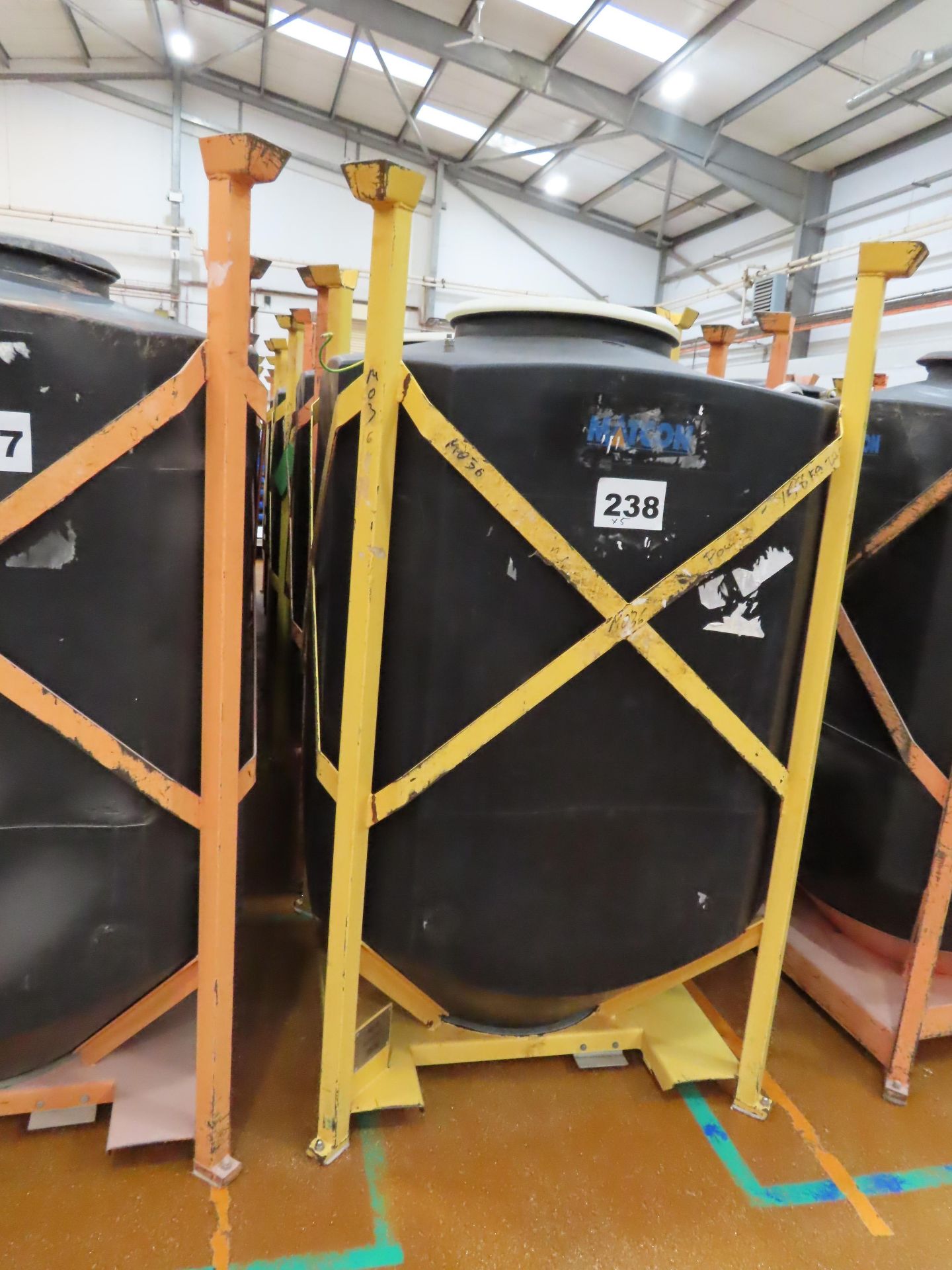 5 X FORKLIFTABLE FRAMES EACH HOLDING A PLASTIC MATCON IBC.