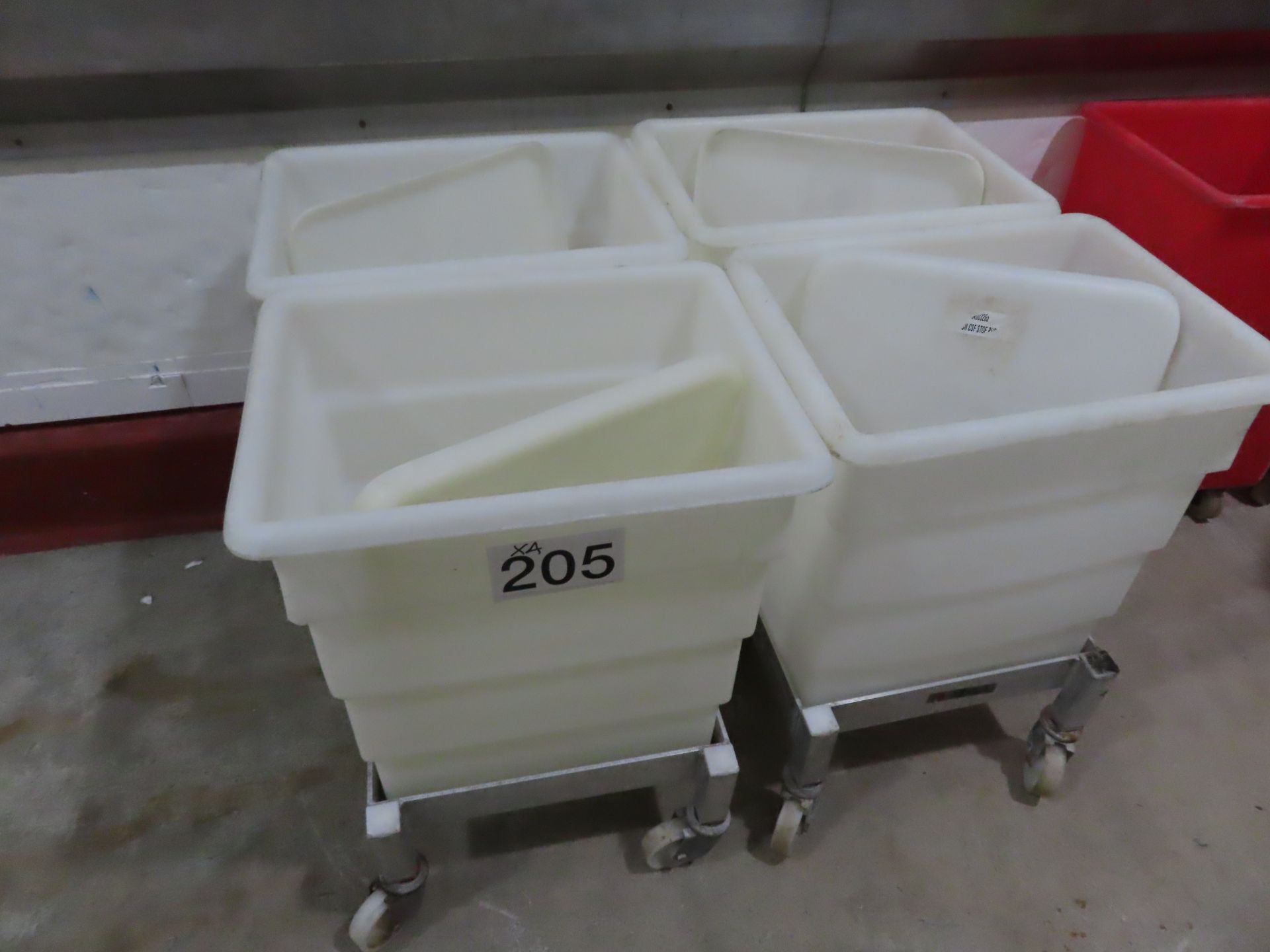 4 X WHITE PLASTIC BINS WITH LIDS ON SYSPAL DOLLIES.