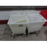 4 X WHITE PLASTIC BINS WITH LIDS ON SYSPAL DOLLIES.