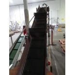 INCLINE FLIGHTED BELT CONVEYOR.