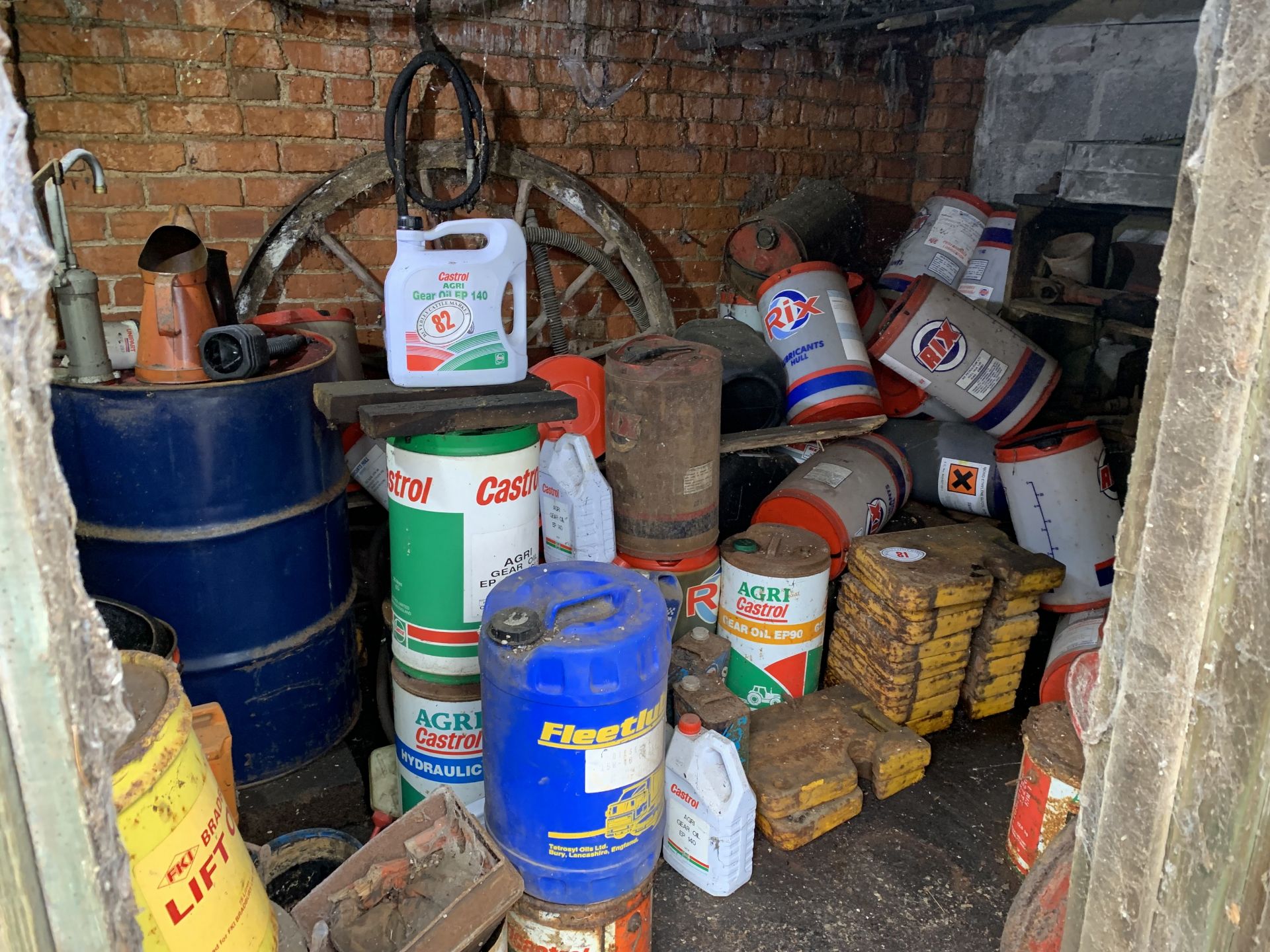 Contents of shed excluding tractor weights, mainly oils & fluids & containers