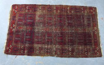 Belouch rug with worn red field, 110 x 195cm.