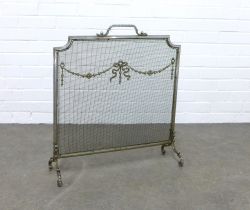 A steel spark guard, mesh panel with ribbon garland pattern, 59 x 67cm.