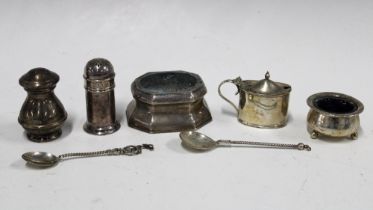 A collection of silver condiments to include pepper pots, salts and mustard, and two continental