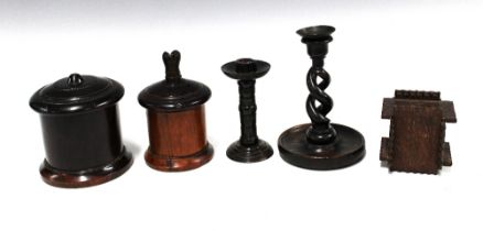 Tramp Art carved wood money box, 9.5 x 10cm and a collection of treen candlesticks and string boxes.