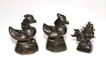 Three bronze opium weights (3)