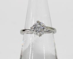 Platinum and diamond solitaire ring, with a one carat diamond in a four claw setting, band stamped