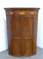 Mahogany and inlaid corner cupboard with satinwood paterae and chequerbanded stringing, panelled