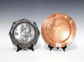 Art Nouveau pewter plate and an Arts & Crafts copper plate, 26cm diameter (2)