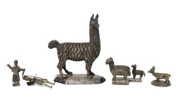 A group of South American white metal figures to include a llama, 9cm high, etc (5)