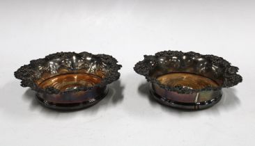 A pair of silver plated wine coasters with wooden inserts and silver buttons for Sheffield 1839,