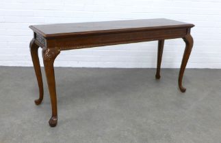 Mahogany consol table, rectangular top and a carved frieze with gadrooned edge, on cabriole legs,