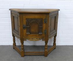 Oak cabinet, triangular with carved cupboard door, 82 X 71 X 33cm