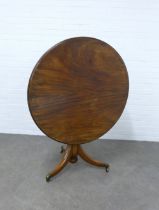 19th century mahogany tilt top table, circular top with a moulded edge, on a baluster column and