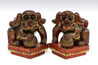 A pair of Chinese painted giltwood Temple Dogs of Fo (2) 12 x 17cm.