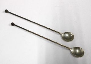 A pair of Dutch silver swizzle spoons with long twisted stems (2)