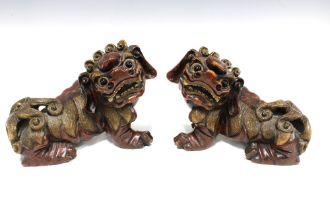 A large pair of chinoiserie wooden Temple Dogs / Lions with bead eyes (2) 27 x 21cm.