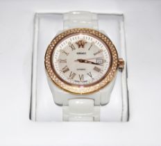 VERSACE, ladies wristwatch, mother of pearl dial with roman numerals, on a white strap, with