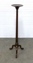 Mahogany torchere stand, with a circular dished top on a reeded column and tripod legs, 43 x 128cm.