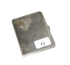 George VI silver cigarette case with engine turned decoration and a yellow metal monogram,