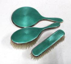 George V silver and enamel dressing table brush set comprising hand mirror, hair brush and clothes