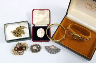 A collection of brooches to include a cameo brooch, mourning brooch with hair locket verso, and